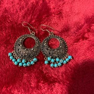 Dark ear rings with turquoise color beads